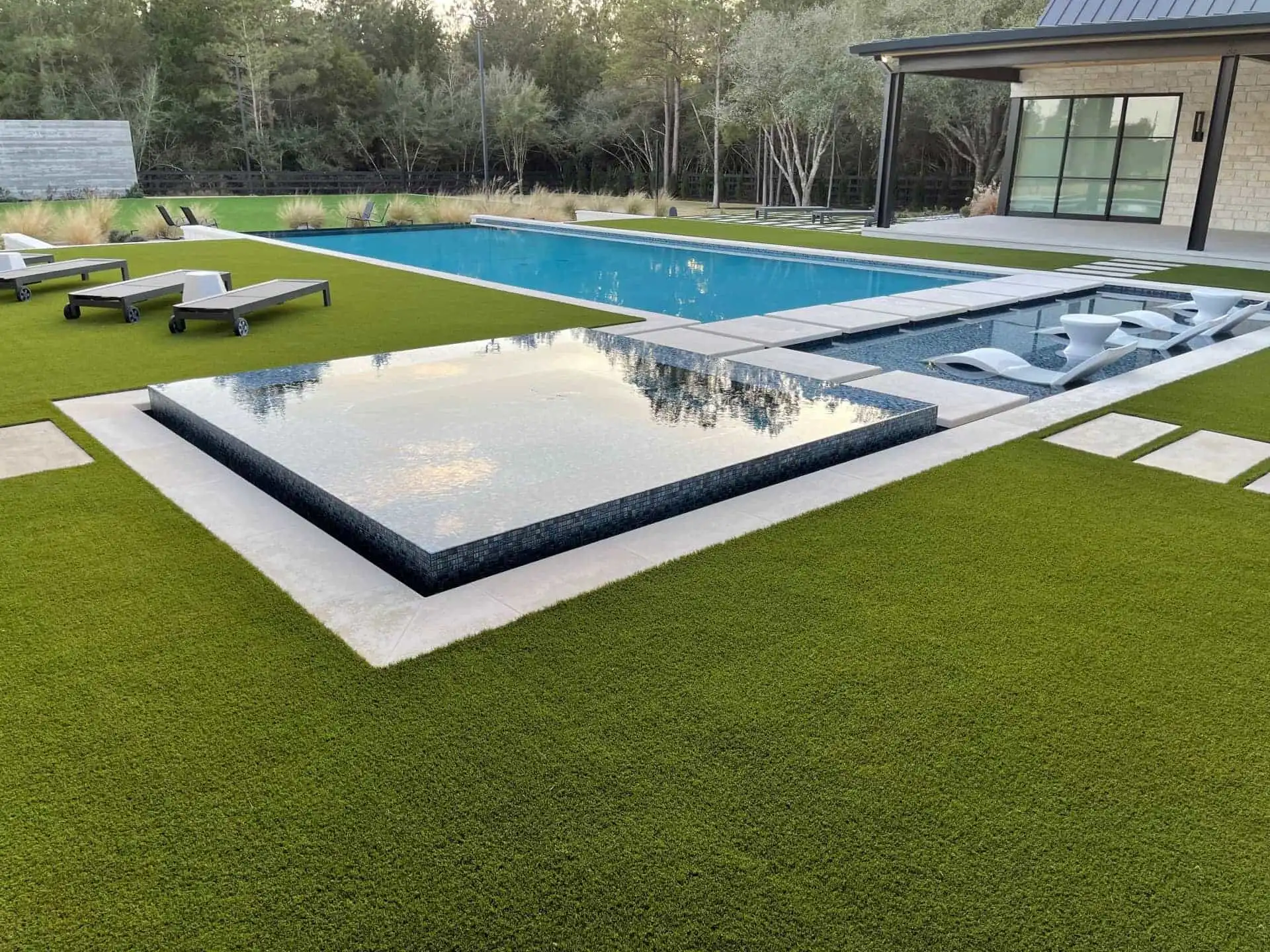 Artificial gras backyard with pool area