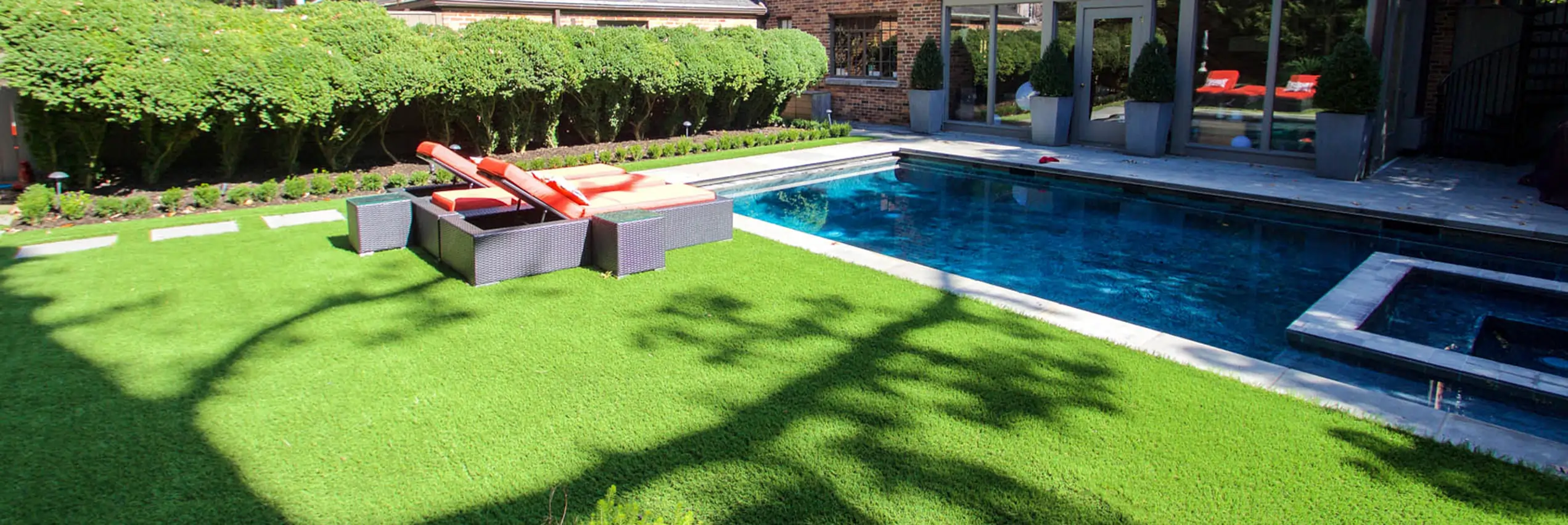 Backyard artificial grass pool area installed by SYNLawn